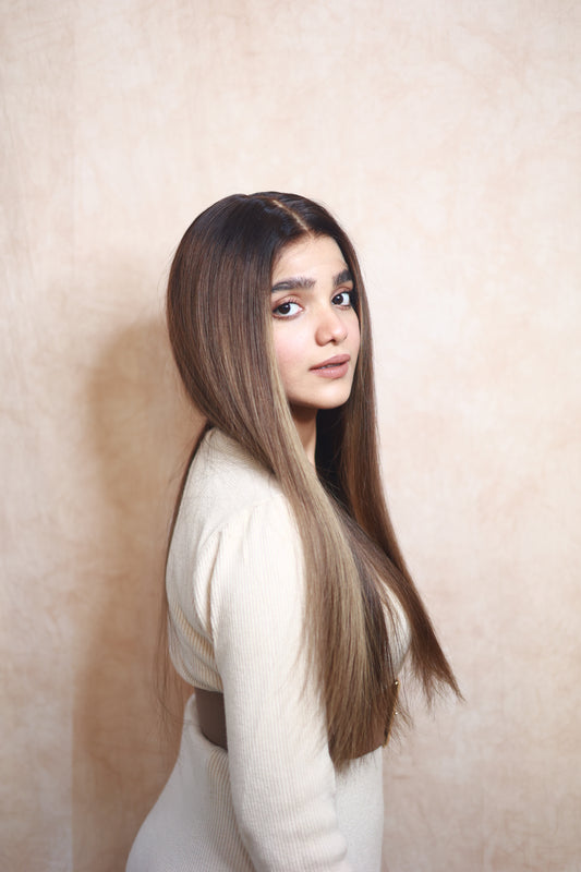 Model wearing COCO straight brown human hair wig with highlights, HD lace, glueless and clipless design, free parting, and breathable construction for all-day comfort