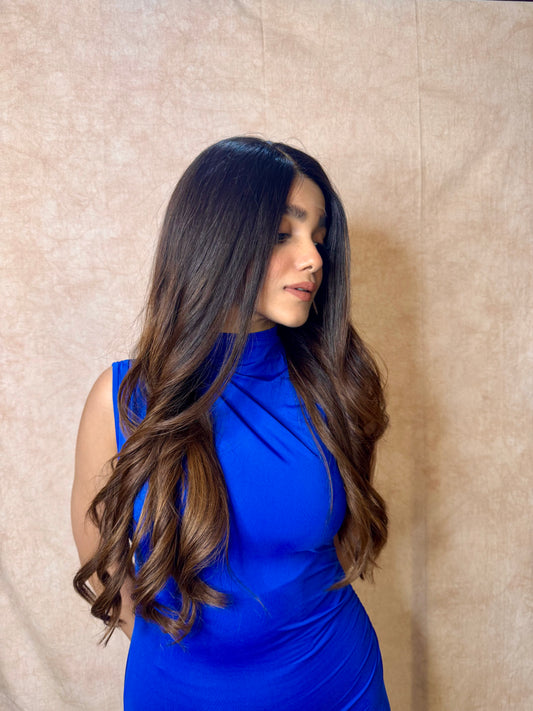 Model wearing AMBER dark brown wavy human hair wig with HD lace, glueless and clipless design, and free parting