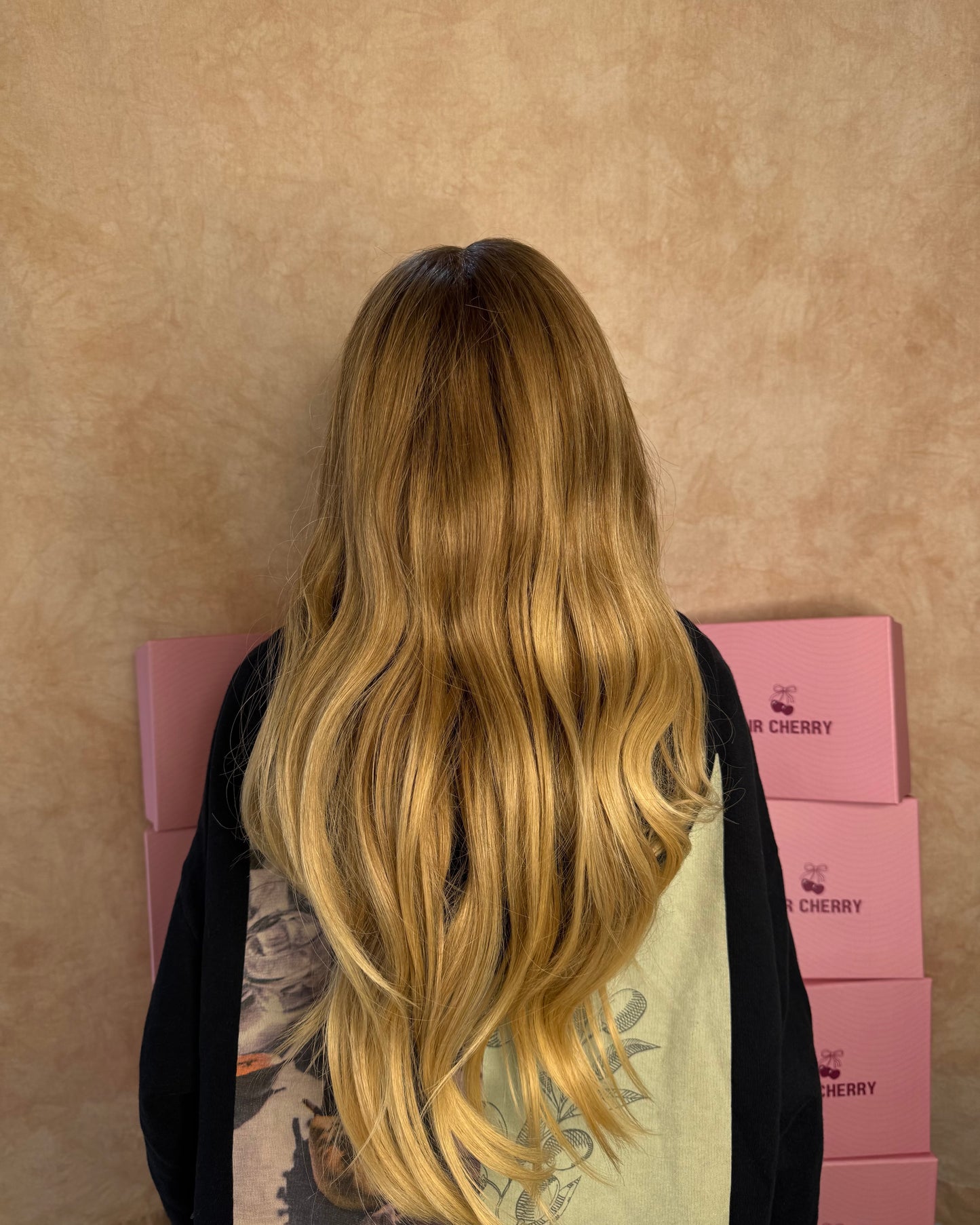 Caramel blonde 100% human hair lace front wig featuring a natural pre-plucked hairline, designed to be ultra-lightweight and breathable.