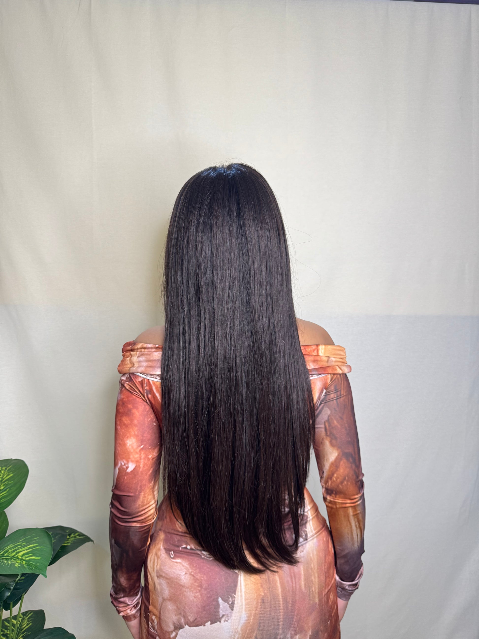 Long straight wig in natural black-brown shade featuring HD lace, lace front with realistic hairline, 6-inch deep parting, and glueless clipless design for beginner-friendly wear.