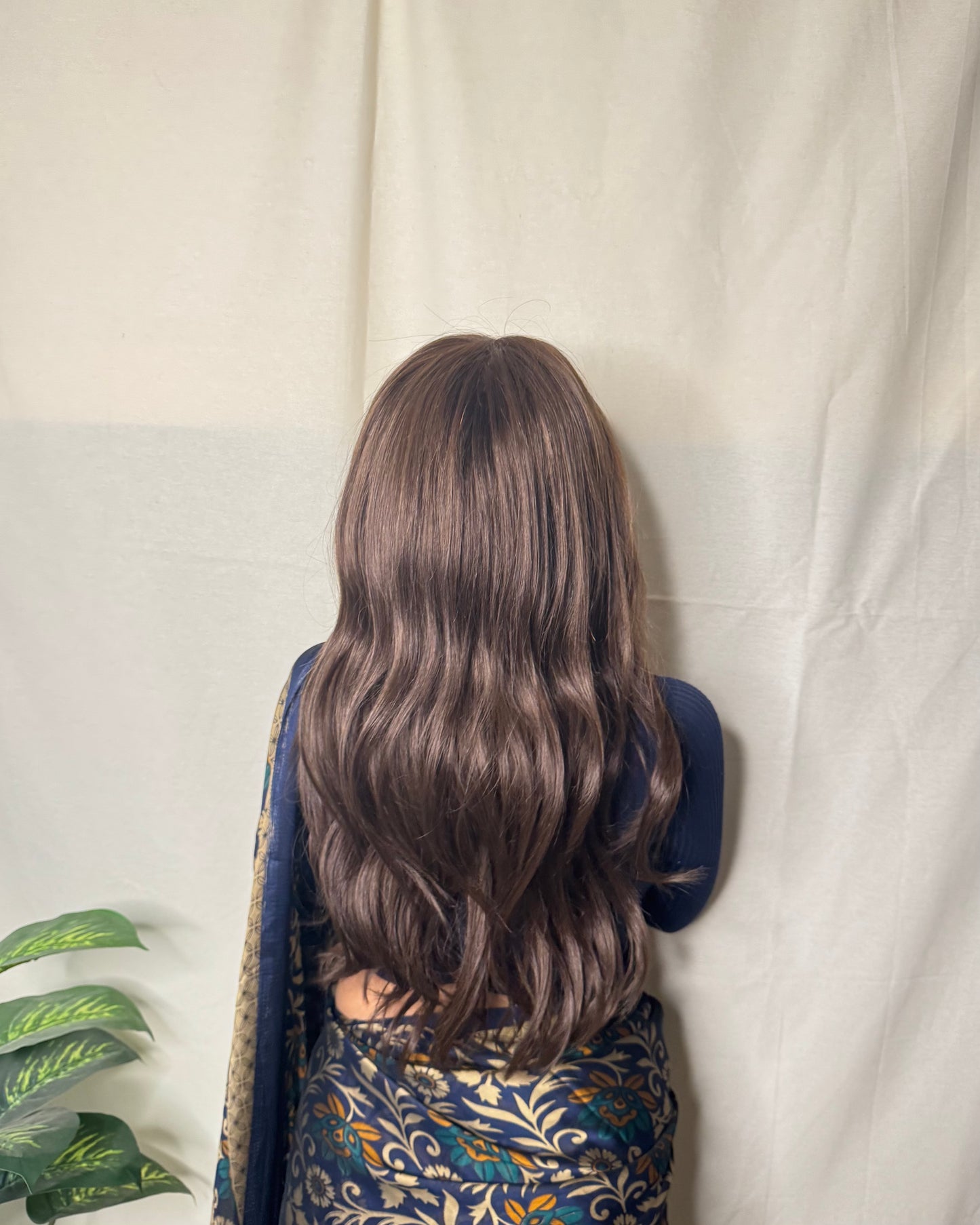 Back view of Daisy HD lace wavy brown human hair wig showing soft natural waves and realistic density – HairCherry
